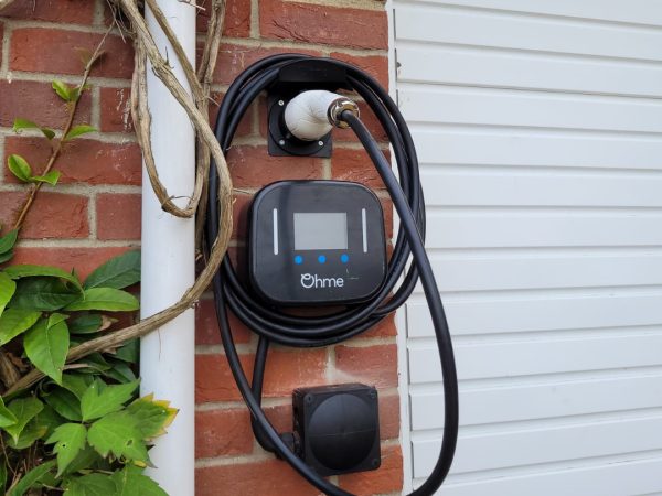 Ohme-EV-charger-installed-on-a-brick-wall